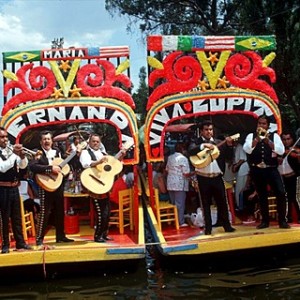 UNESCO patrimony site Xochimilco, features 'trinjeras', brightly-painted gondolas, which passengers and tourists hire to be poled around the canals of the region. Passengers can hire mariachis from passing boats, and buy food, drinks, and folk arts. The canals were part of an ancient irrigation and waterway system. Xochimilco was the original name of the area that is now Mexico City.