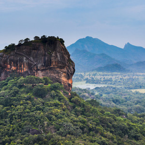 Sigiriya Rock Fortress, seen from Pidurangala Rock, Sri Lanka, Asia. This is a photo of Sigiriya Rock Fortress, seen from Pidurangala Rock, Sri Lanka, Asia. Sigiriya Rock Fortress, located in the 'cultural triangle' is the most popular tourist attraction in Sri Lanka. Pidurangala Rock, just opposite offers an extremely impressive view over Sigiriya Rock and the surrounding Sri Lanka landscape. It is hard to believe that Sigiriya Rock Fortress used to be the inside of a volcano.